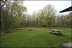 playground, picnic area and pit toilet by Duneside Shelter